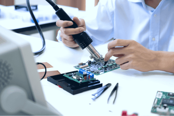 technician working on a medical device